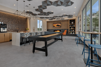 Community clubhouse with shuffleboard and fireplace
